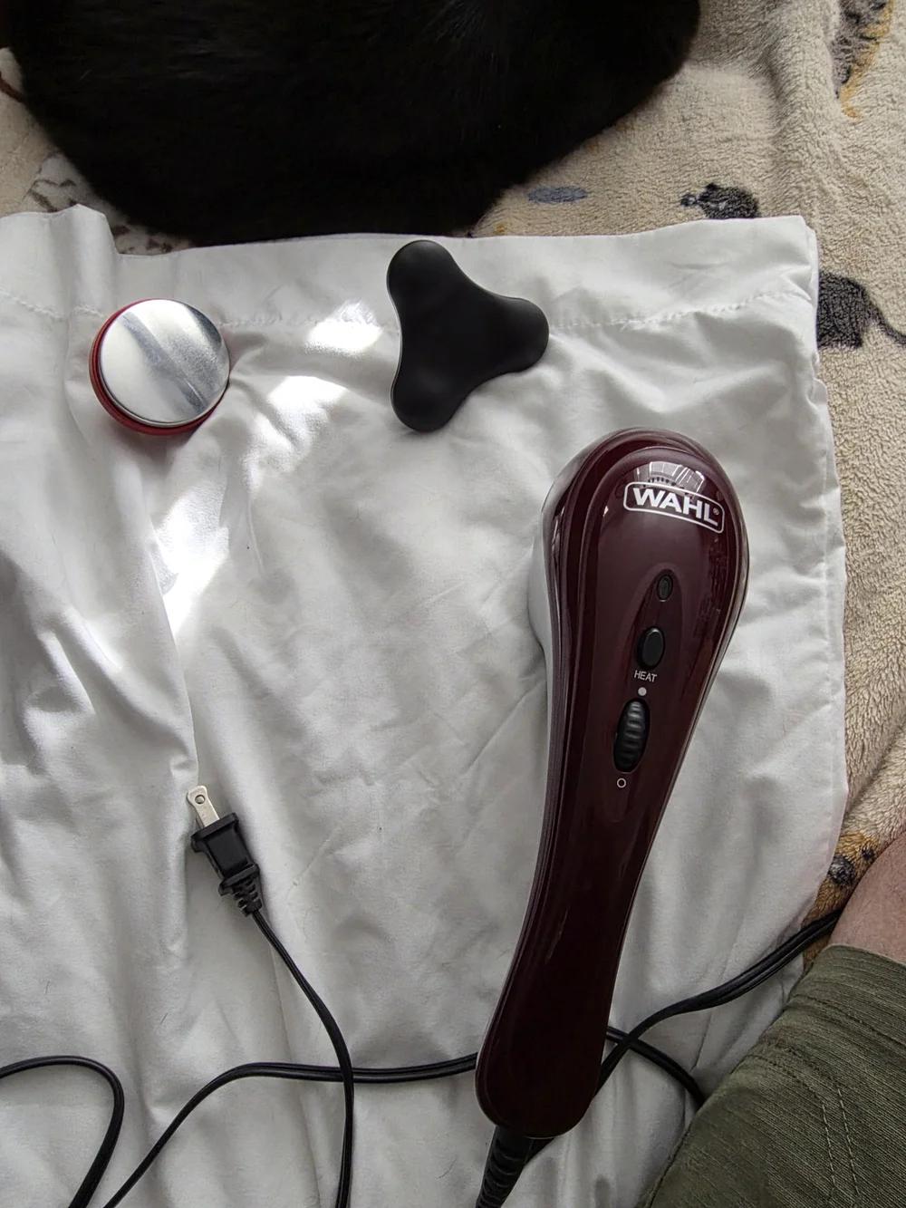 Wahl Corded Handheld Massager in Deep Burgundy with Black Accents